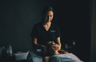 Facelogic esthetician performing a facial massage