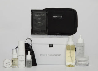 Epicutis Holiday Box with skincare products and a black pouch arranged on the presentation box.