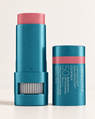 Colorescience Sunforgettable Total Protection Color Balm SPF 50 stick beside its cap.